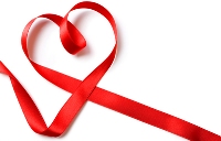 Red ribbon shaped into a heart.