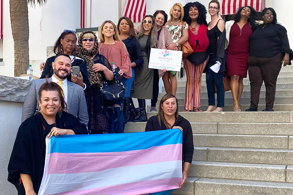 Arianna Lint & Arianna's Center staff and supporters hold trans flag at Florida State Capital.