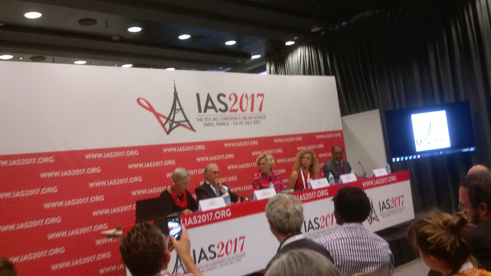 Panelists at conference, sitting at a table in front of sign that reads "I A S 2017".