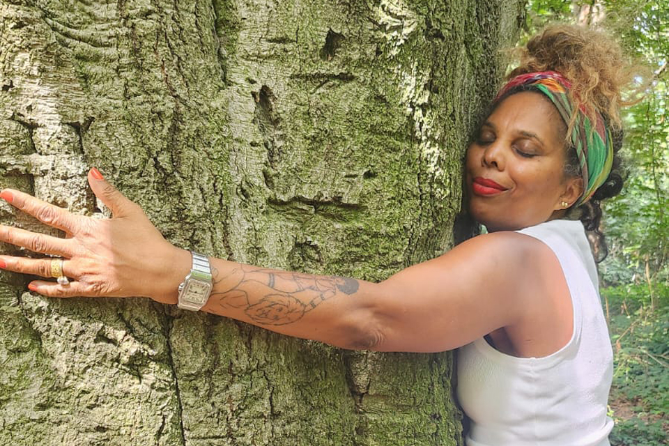 Louise Vallace hugging a tree. 