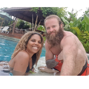 Blogger Louise Vallace and her husband in a swimming pool. 