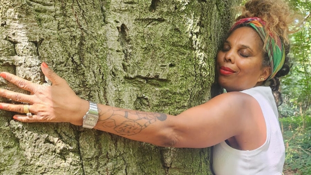 Louise Vallace hugging a tree. 