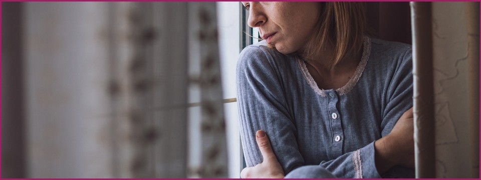 Woman hugging herself.